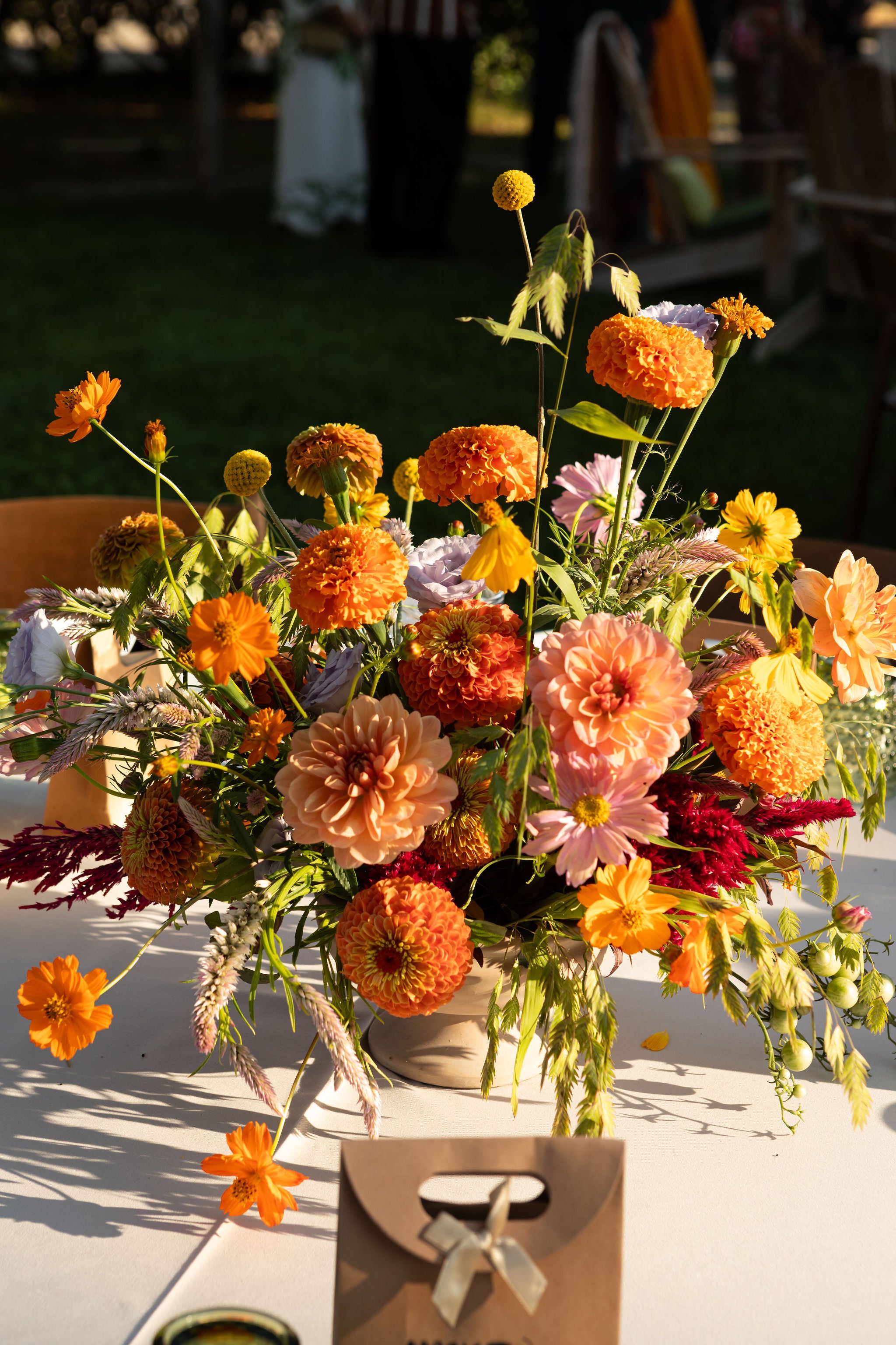 Bright and colorful centerpiece floral arrangement created by Flower Porch at Front Porch Farm in Healdsburg CA