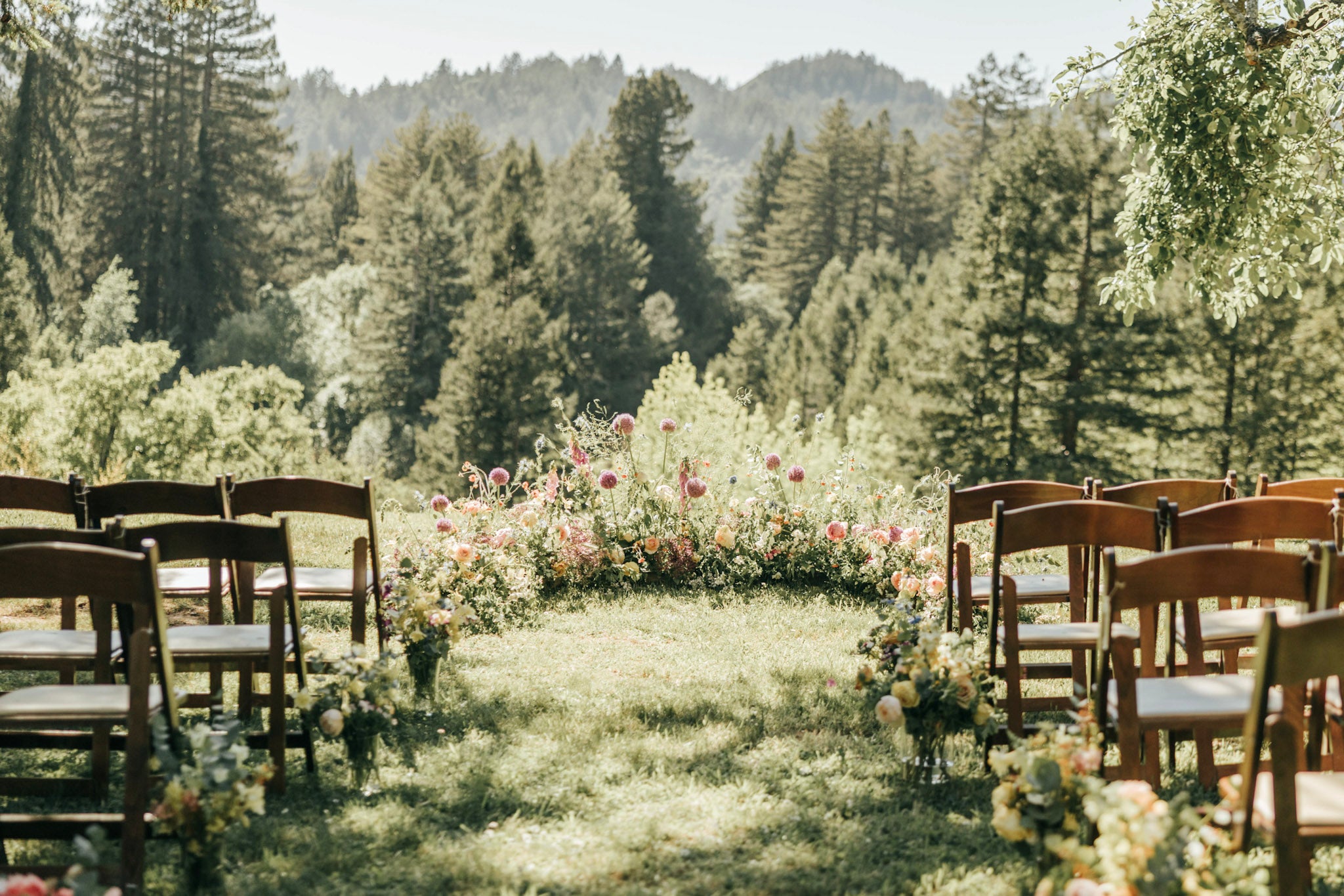 Wedding ceremony floral crescent featuring organic spring flowers from Front Porch Farm at the Stavrand in Sonoma County.