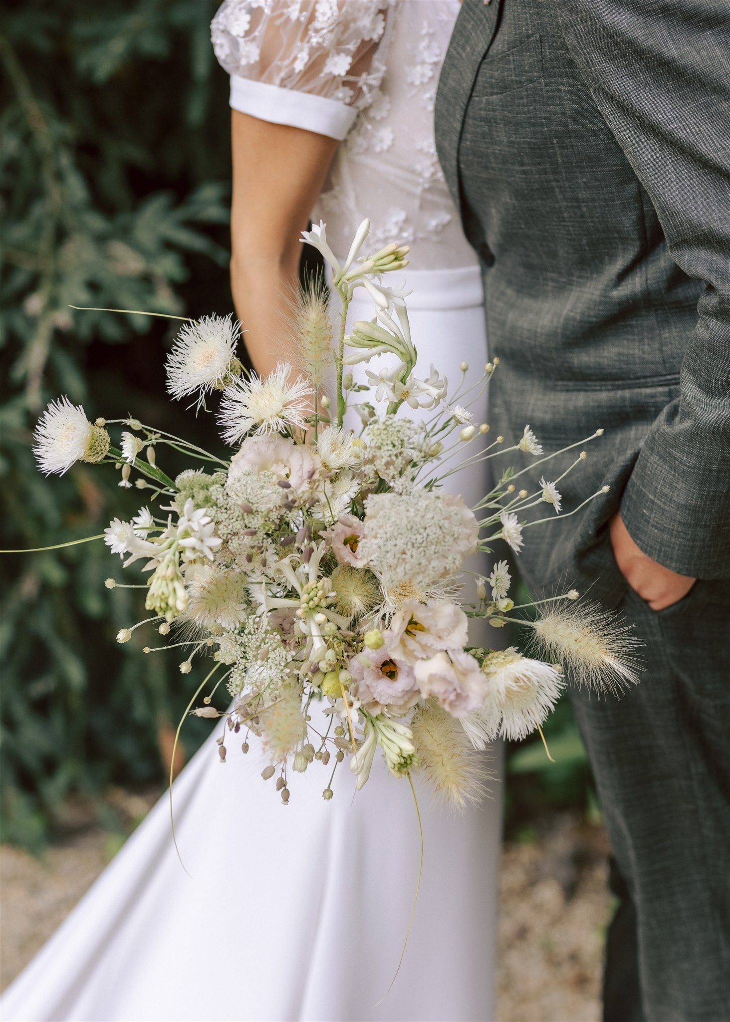 Bride holding a bouquet of white and green flowers from Front Porch Farm in Healdsburg CA